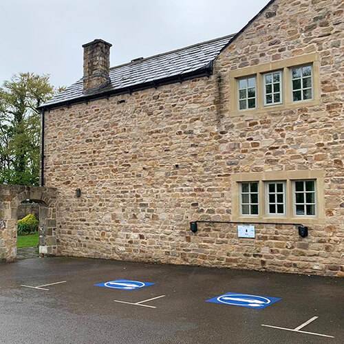 two electric vehicle charging point bays in the car park of The Fleece Inn near Lancaster